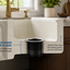 Sink flange extension with text describing its features in a kitchen setting.